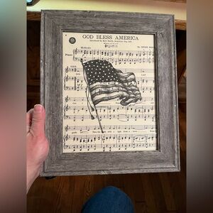 American flag hand drawn on God Bless America sheet music by The Art Escape